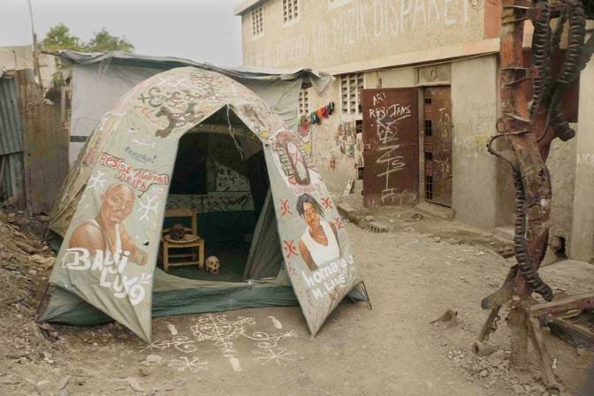 The tent that housed Andre Eugene for one year after the earthquake was turned into an altar as a memory of Louko, his friend, 2nd Ghetto Biennale 2011, Port-au-Prince, Haiti Photo: John Cussans